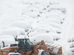 Monday morning; buried cars, snow keeps falling